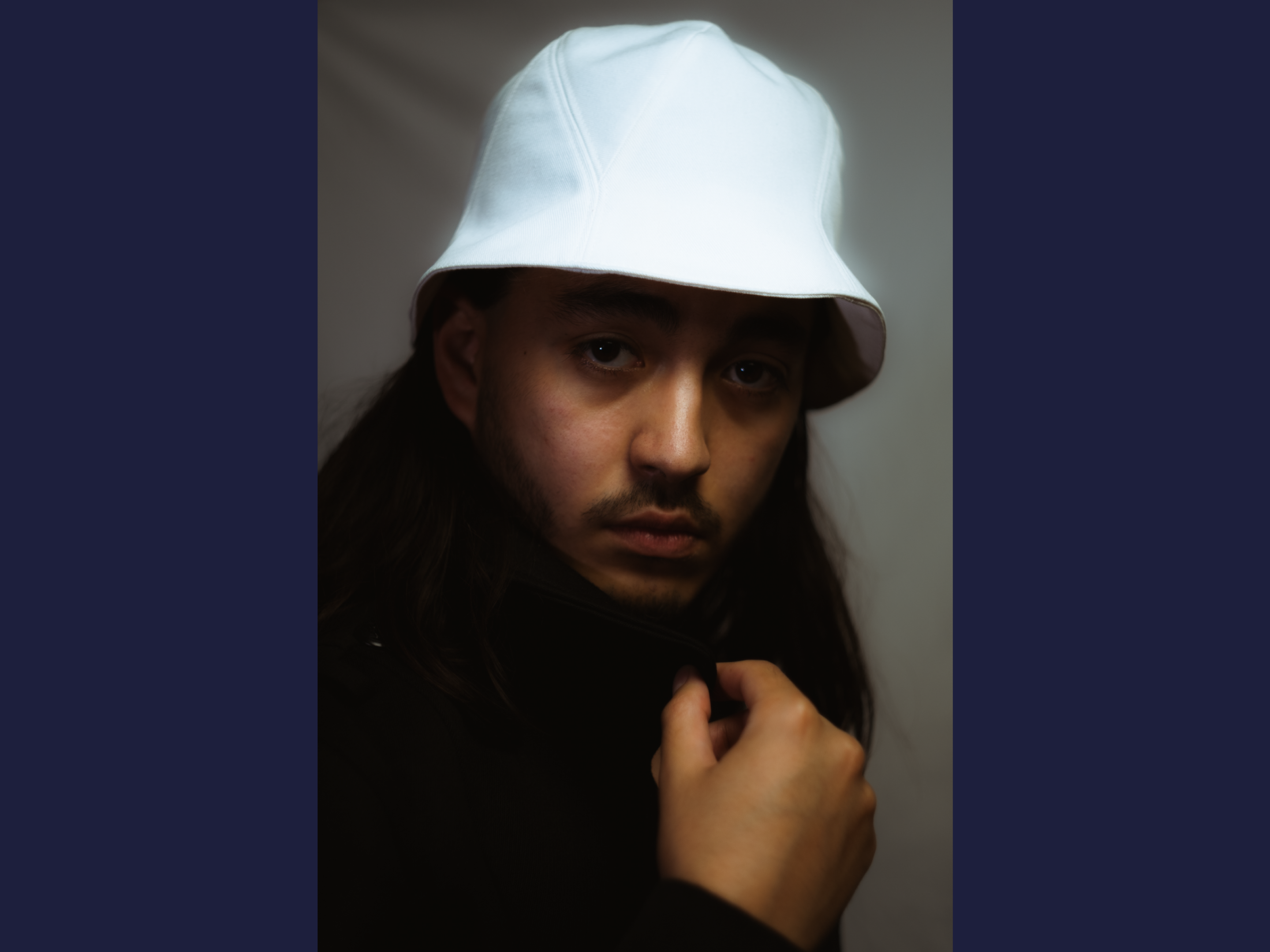 Kaïto is wearing a Le Panache Paris© bucket hat made in France with 100% cotton white twill.